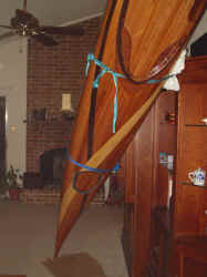 The boat looks bigger inside the house.